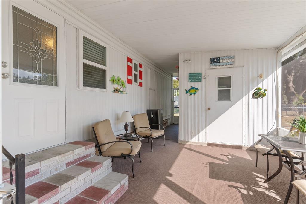1610 Reynolds Road, Unit 98 Lakeland, FL 33801 - Photo 6 of 36 a living room with furniture and wooden floor