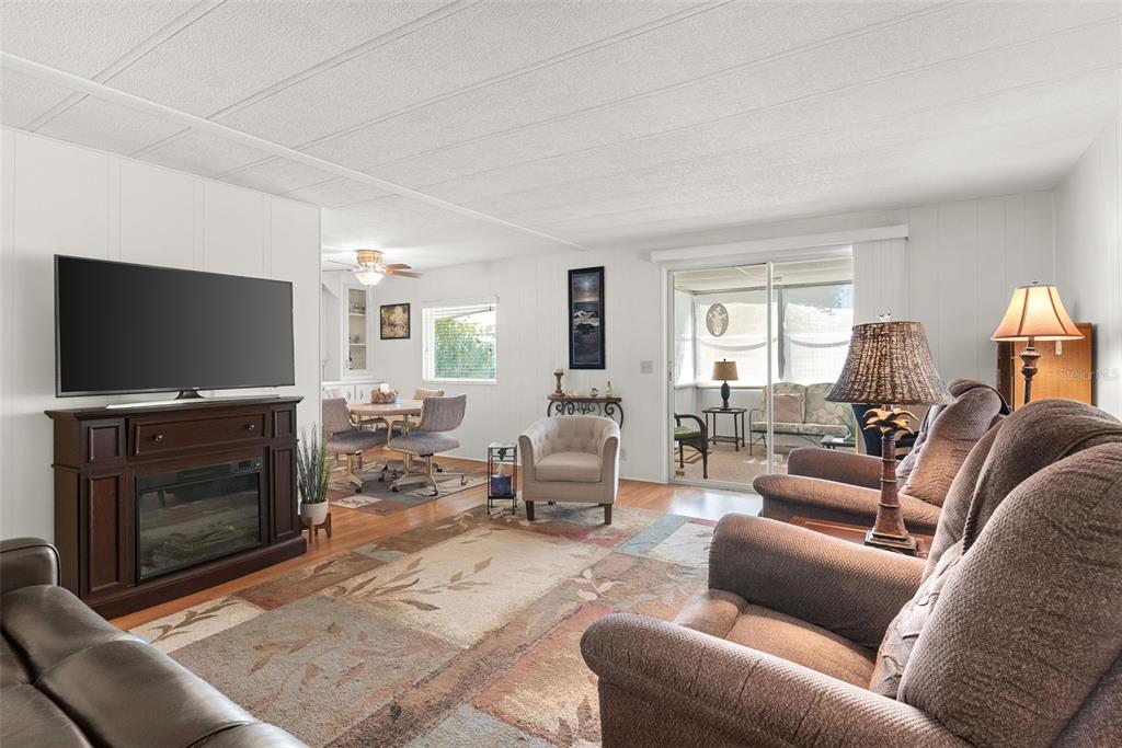 1610 Reynolds Road, Unit 98 Lakeland, FL 33801 - Photo 9 of 36 a living room with furniture and a flat screen tv