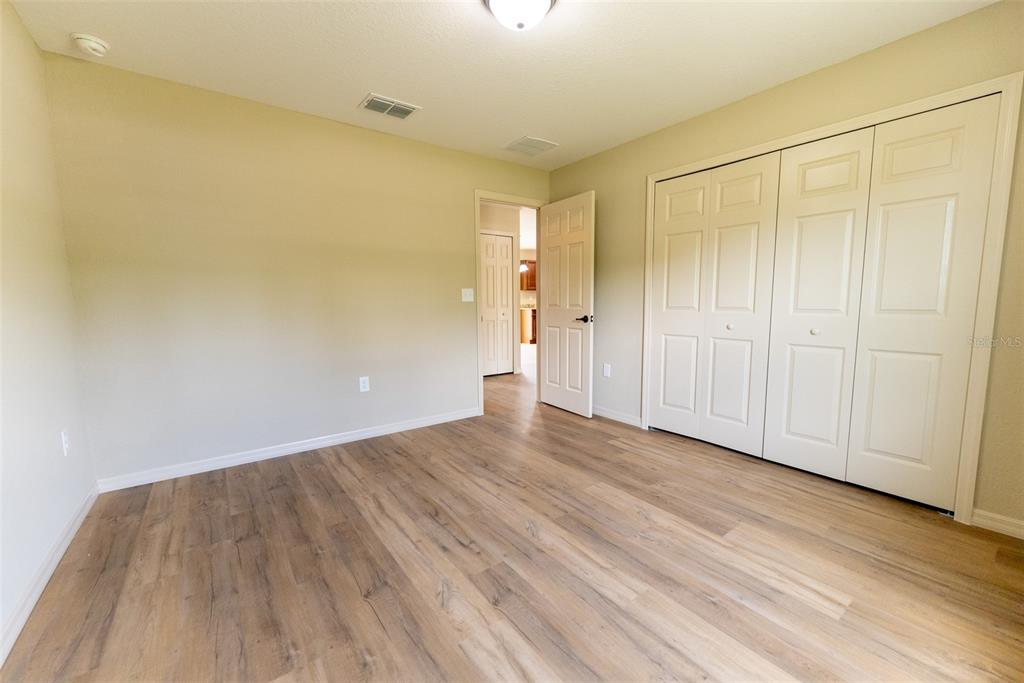 20 Willow Road Ocala, FL 34472 - Photo 21 of 28 a view of an empty room and wooden floor