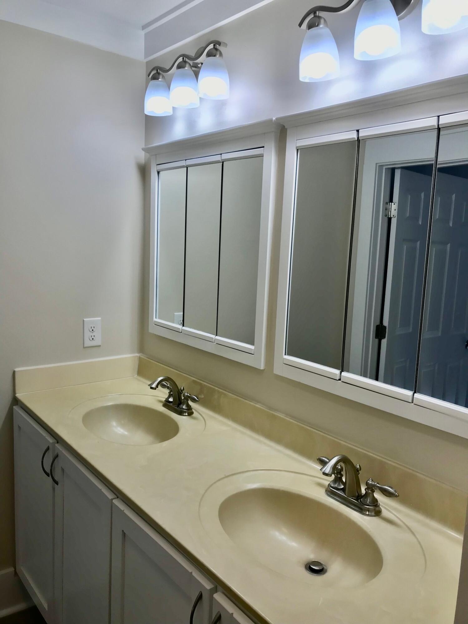 8 Sally Lane Santa Rosa Beach, FL 32459 - Photo 11 of 17 a bathroom with a sink and a mirror
