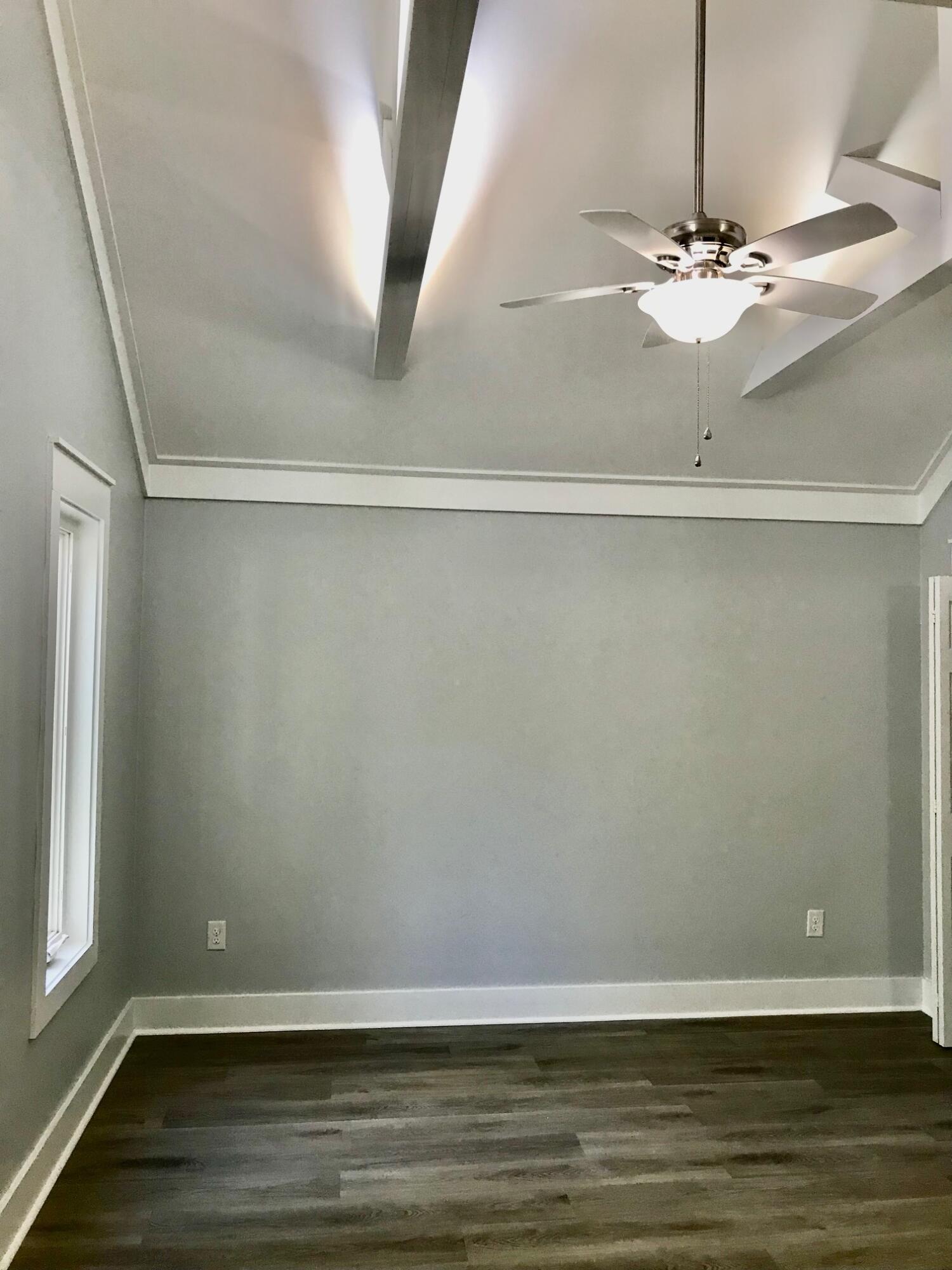 8 Sally Lane Santa Rosa Beach, FL 32459 - Photo 13 of 17 a view of a room with wooden floor and fan