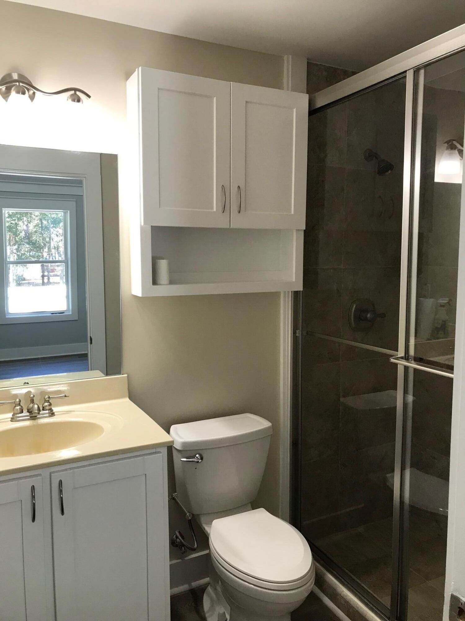 8 Sally Lane Santa Rosa Beach, FL 32459 - Photo 17 of 17 a bathroom with a sink a toilet and shower