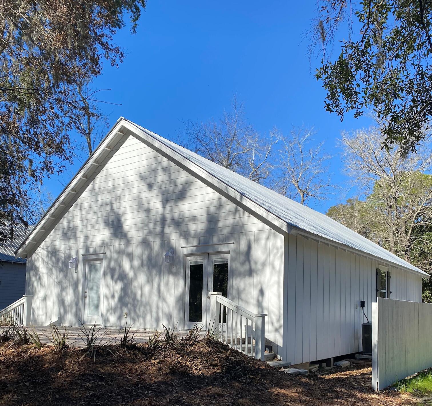 8 Sally Lane Santa Rosa Beach, FL 32459 - Photo 3 of 17 a front view of a house with a yard