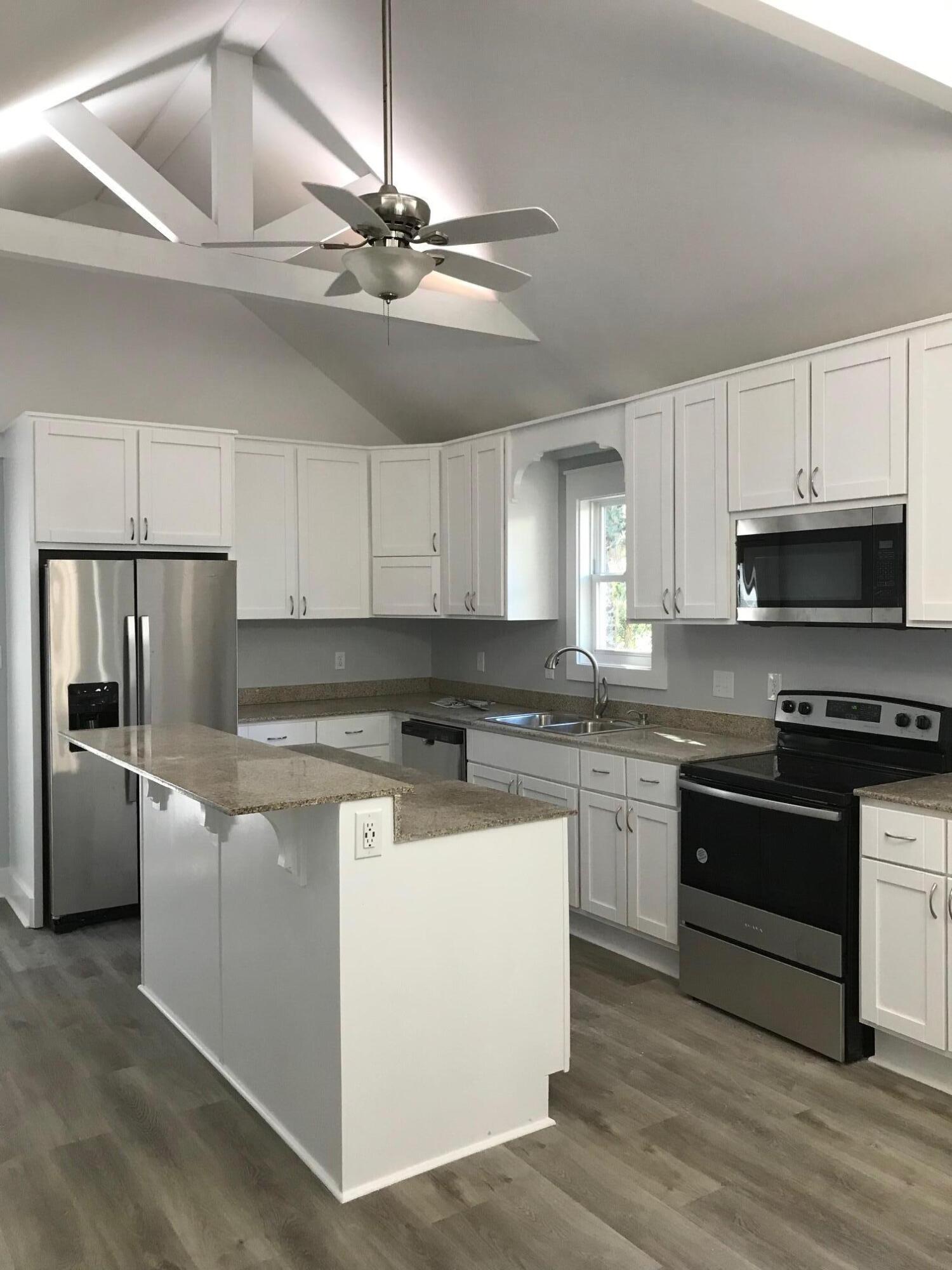 8 Sally Lane Santa Rosa Beach, FL 32459 - Photo 6 of 17 a kitchen with cabinets stainless steel appliances and a counter space