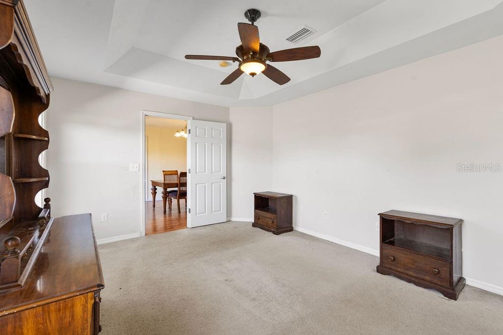 9590 Southwest 98th Avenue Gainesville, FL 32608 - Photo 16 of 25 a living room with furniture and a flat screen tv