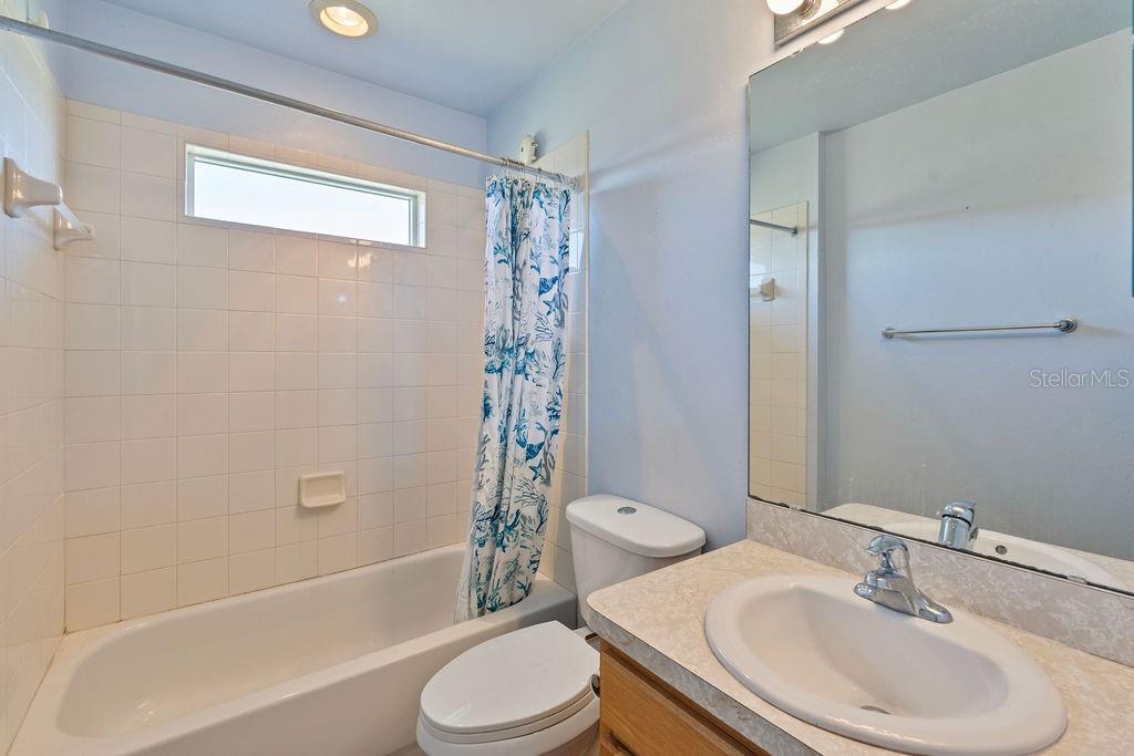 9590 Southwest 98th Avenue Gainesville, FL 32608 - Photo 22 of 25 a bathroom with a sink toilet and shower