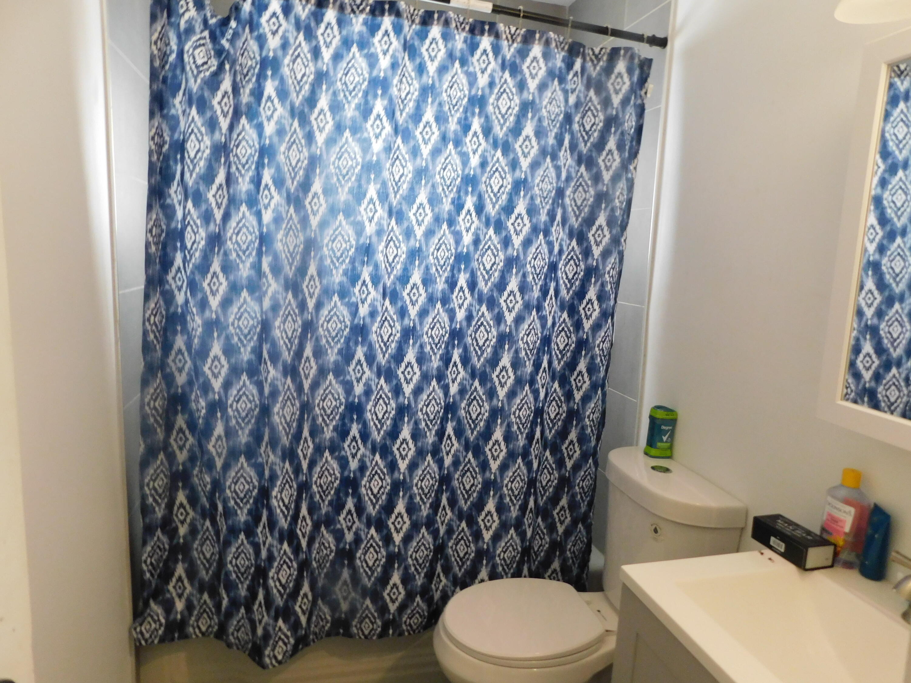 837 Spruce Street Hammond, IN 46324 - Photo 11 of 16 a white toilet sitting next to a bath tub