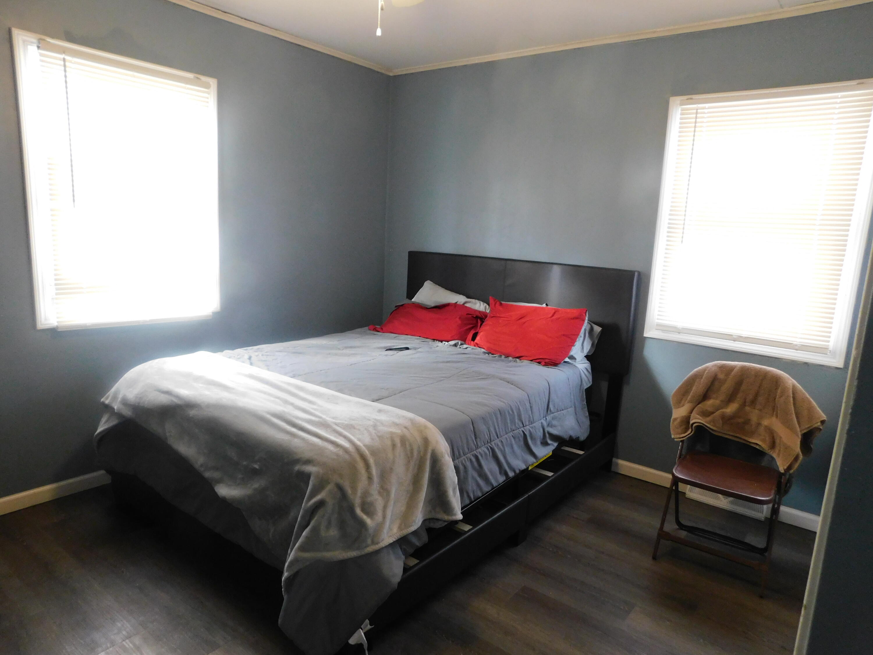 837 Spruce Street Hammond, IN 46324 - Photo 12 of 16 a bedroom with a bed and window