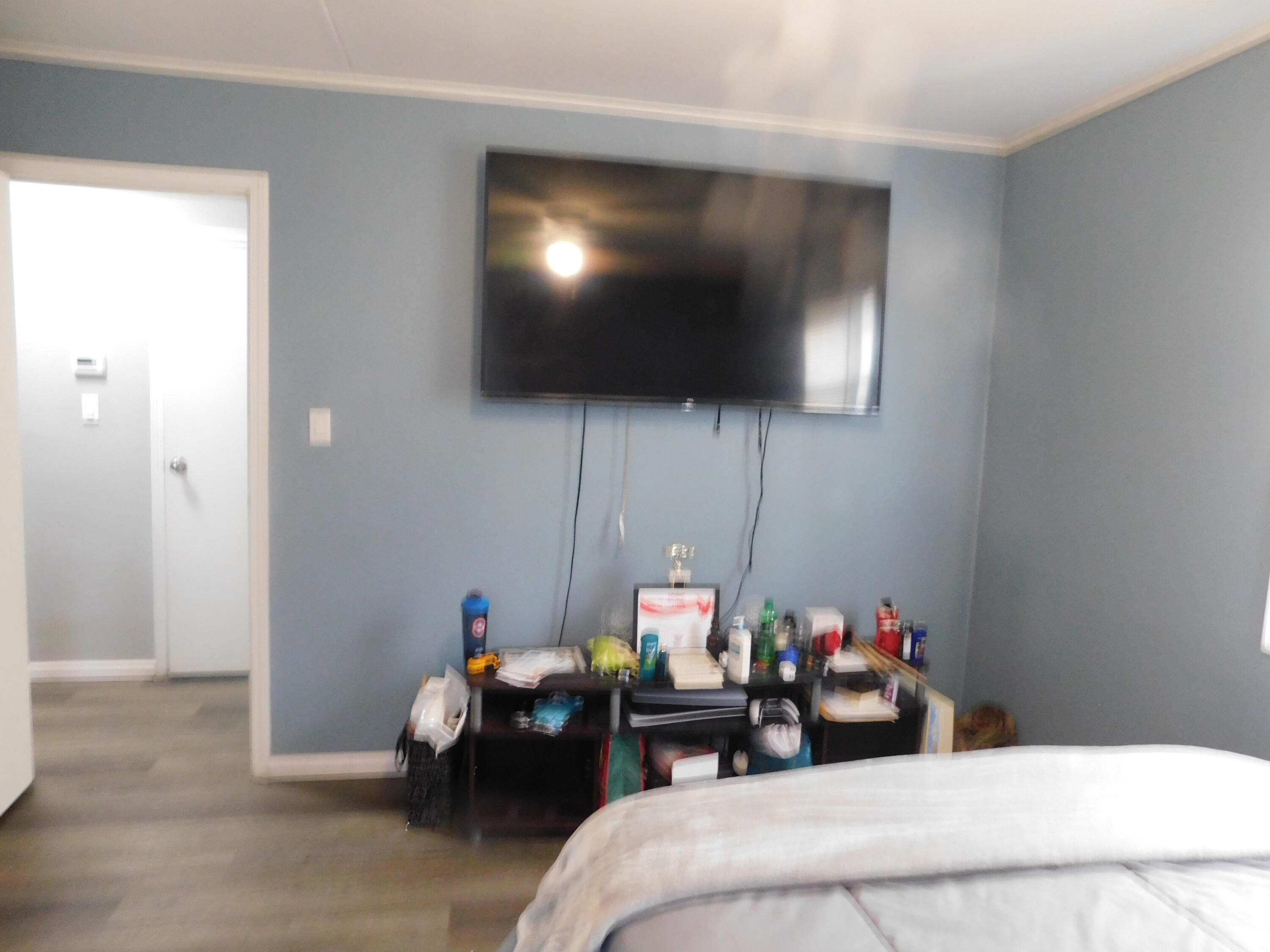 837 Spruce Street Hammond, IN 46324 - Photo 13 of 16 a living room with furniture and a flat screen tv