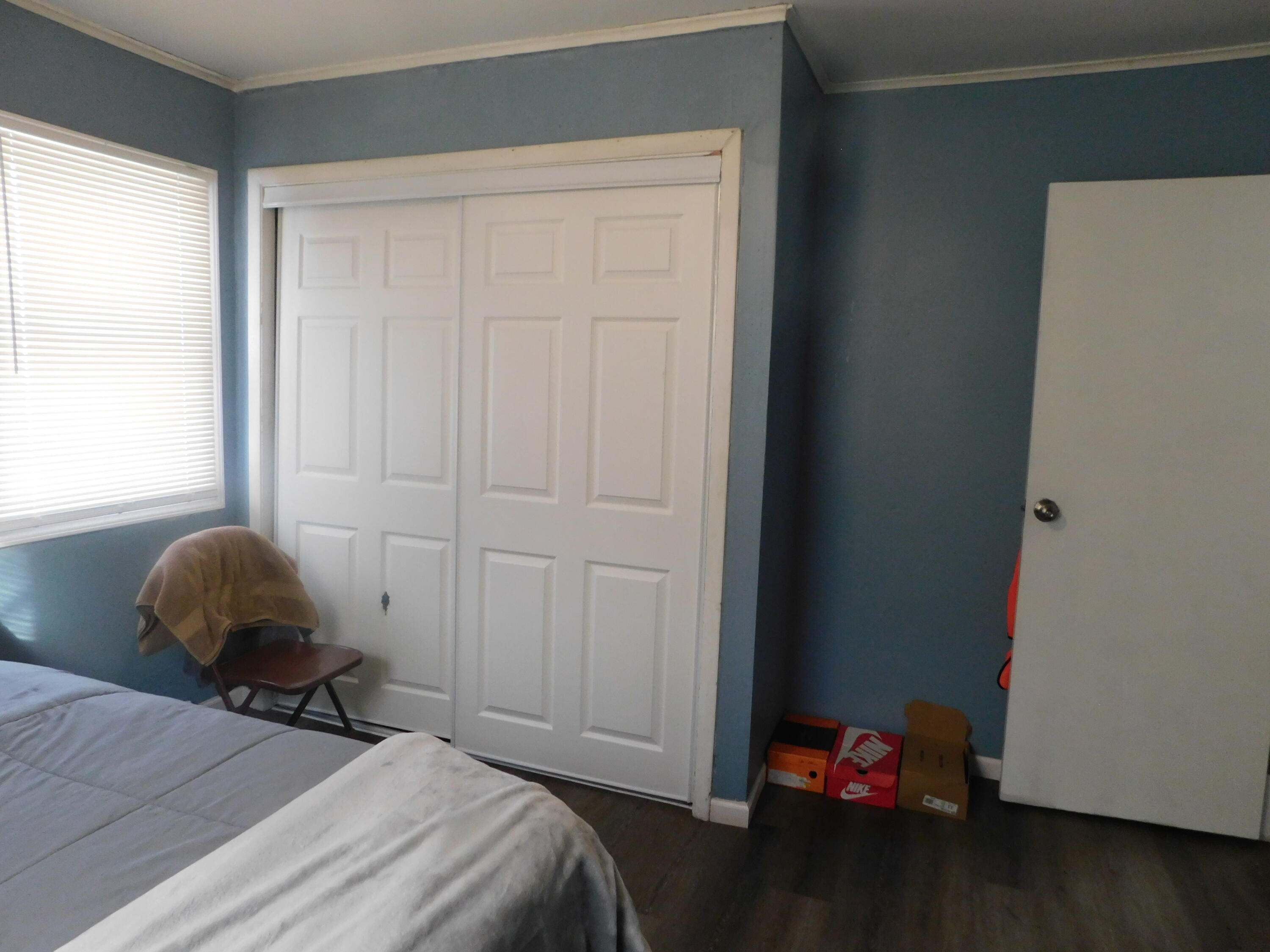 837 Spruce Street Hammond, IN 46324 - Photo 14 of 16 a bedroom with a bed and a window