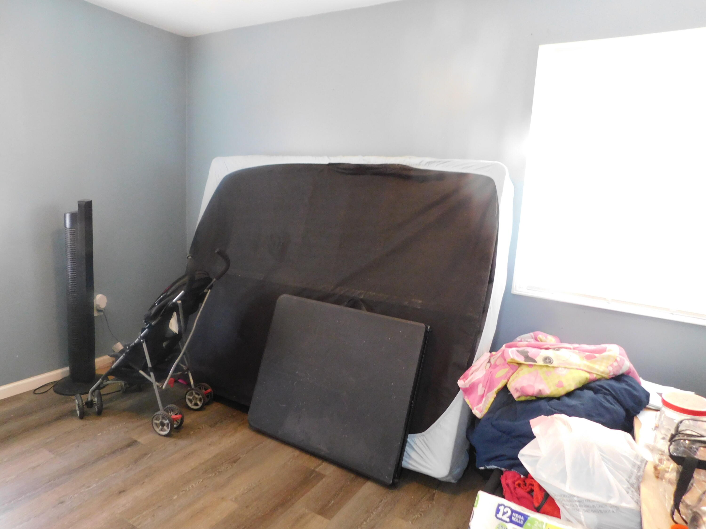 837 Spruce Street Hammond, IN 46324 - Photo 15 of 16 a bedroom with a bed and gym equipment