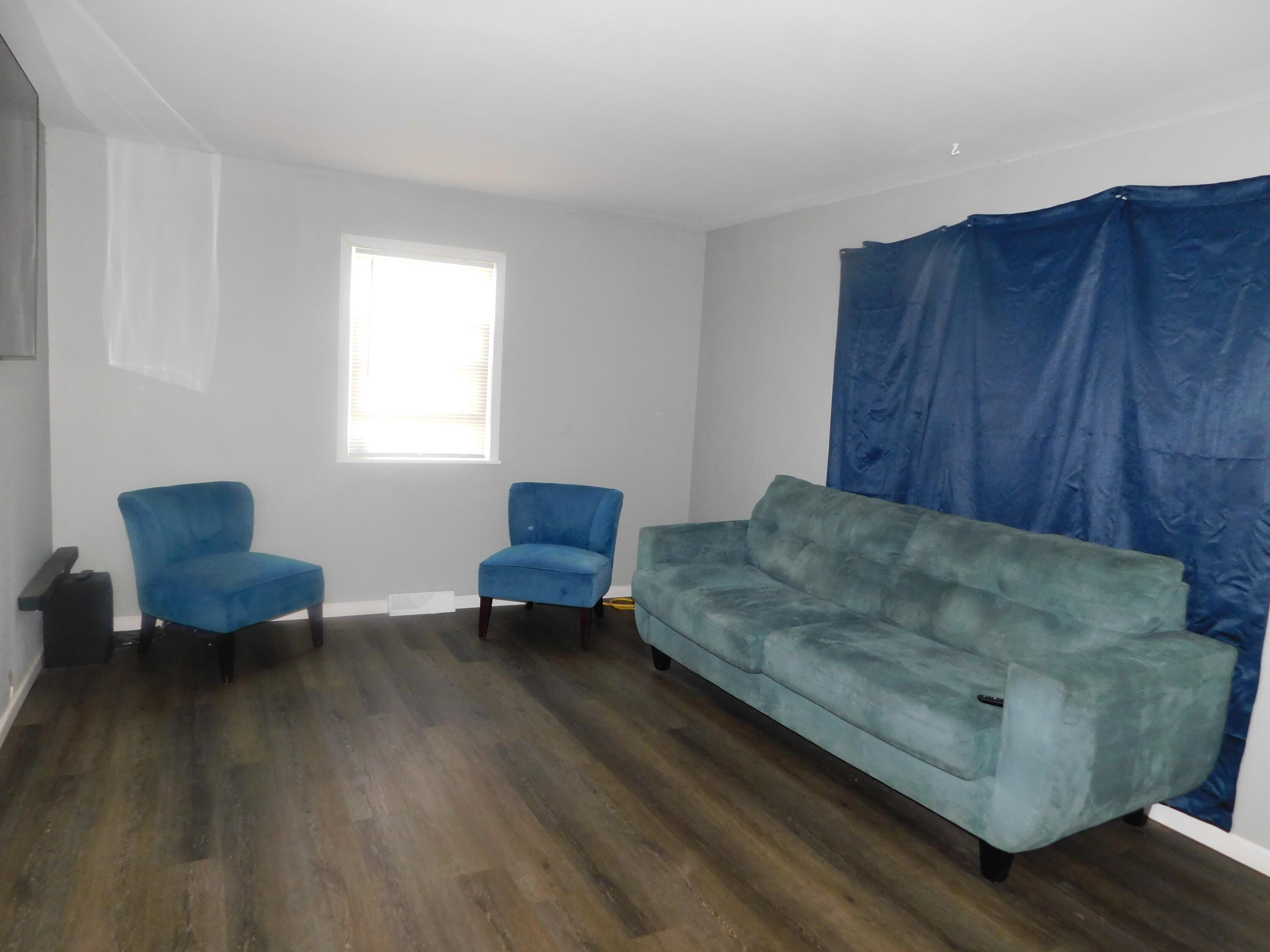 837 Spruce Street Hammond, IN 46324 - Photo 3 of 16 a living room with furniture and a potted plant