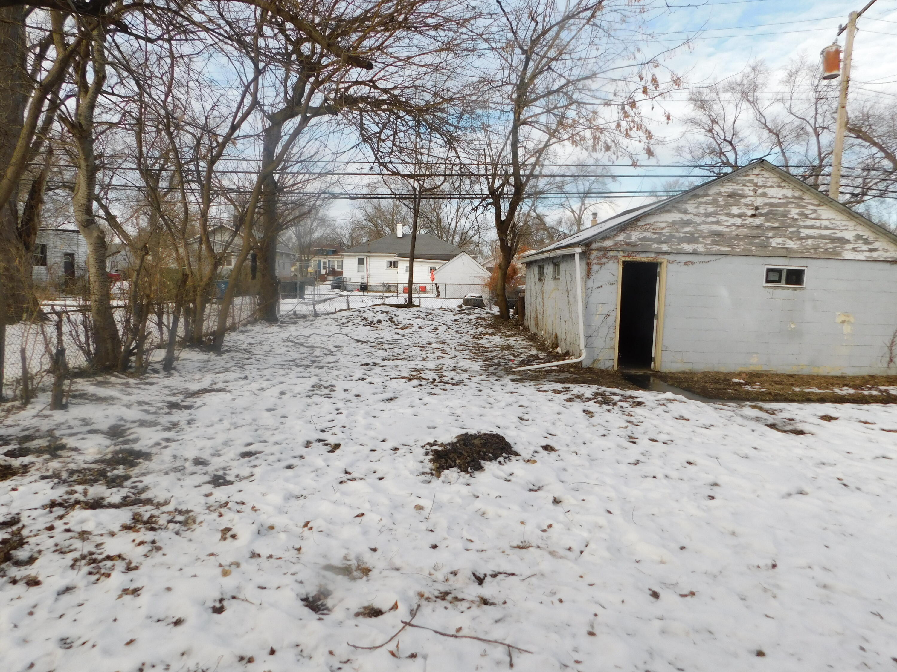 837 Spruce Street Hammond, IN 46324 - Photo 6 of 16 a view of a yard covered with snow