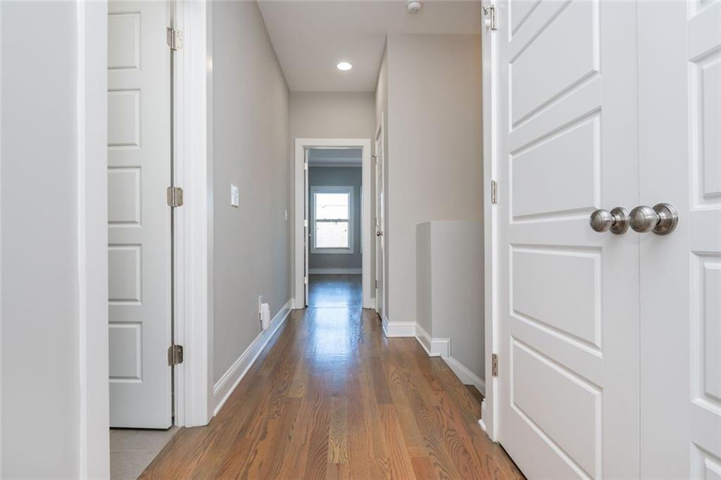 2138 Shale Lane Northwest, Unit 260 Atlanta, GA 30318 - Photo 22 of 39 a view of a hallway with wooden floor