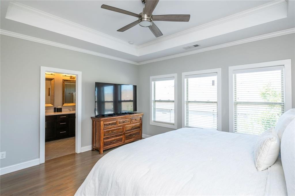 2138 Shale Lane Northwest, Unit 260 Atlanta, GA 30318 - Photo 24 of 39 a bedroom with a bed and a dresser