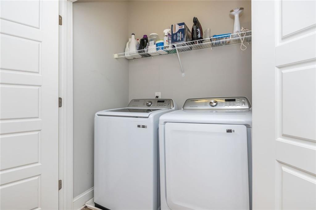 2138 Shale Lane Northwest, Unit 260 Atlanta, GA 30318 - Photo 27 of 39 a utility room with dryer and washer