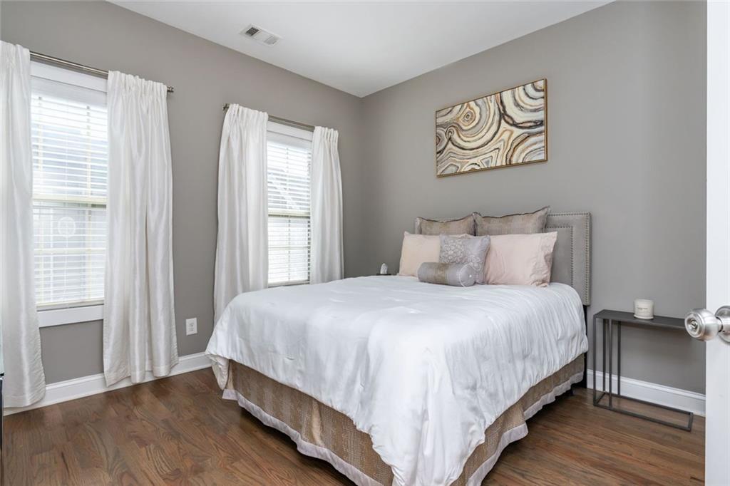 2138 Shale Lane Northwest, Unit 260 Atlanta, GA 30318 - Photo 28 of 39 a large bed sitting in a bedroom next to a window