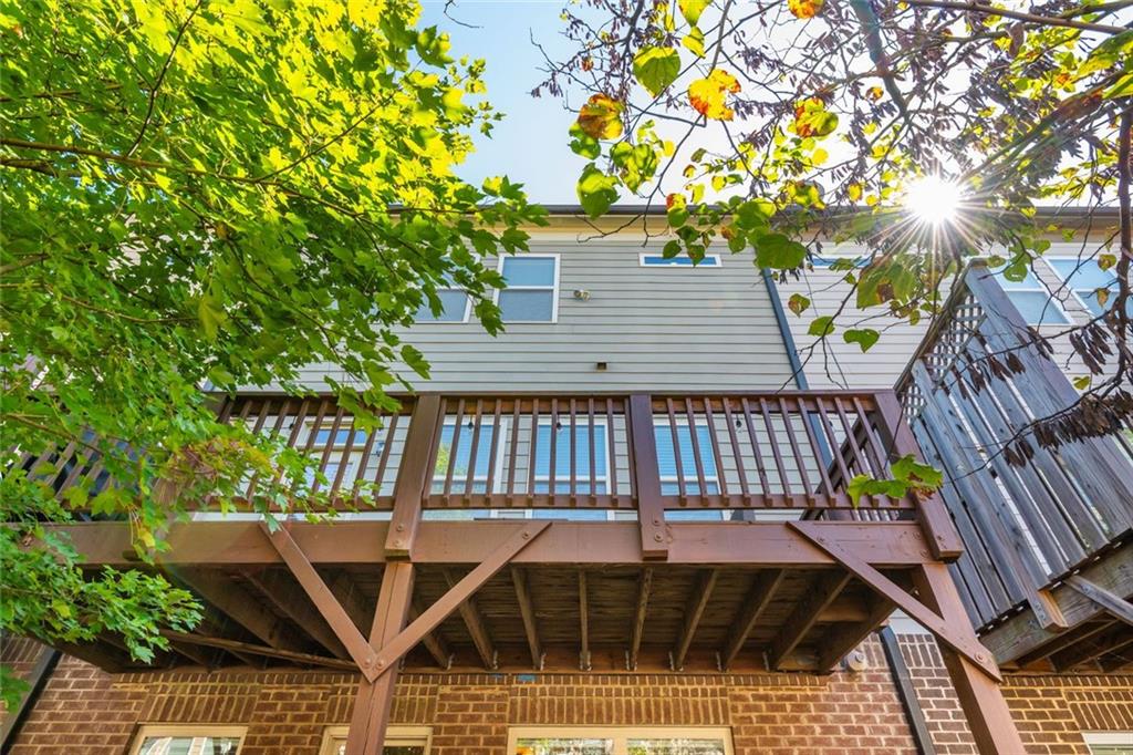 2138 Shale Lane Northwest, Unit 260 Atlanta, GA 30318 - Photo 38 of 39 a view of balcony with wooden floor and outdoor seating