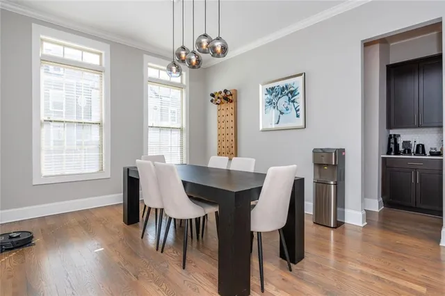 a view of a dining room with furniture window and wooden floor