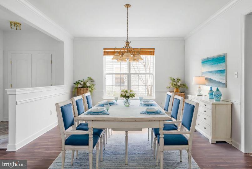 35560 Dry Brook Drive Rehoboth Beach, DE 19971 - Photo 12 of 63 a view of a dining room with furniture window and wooden floor