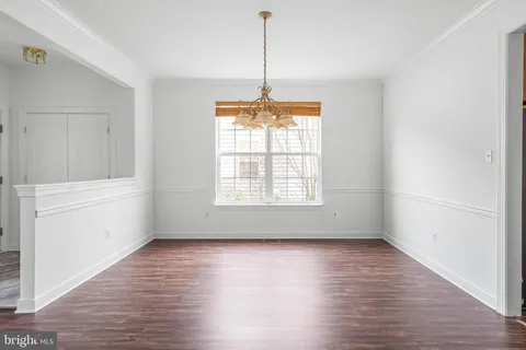 a kitchen with stainless steel appliances granite countertop wooden floors and sink