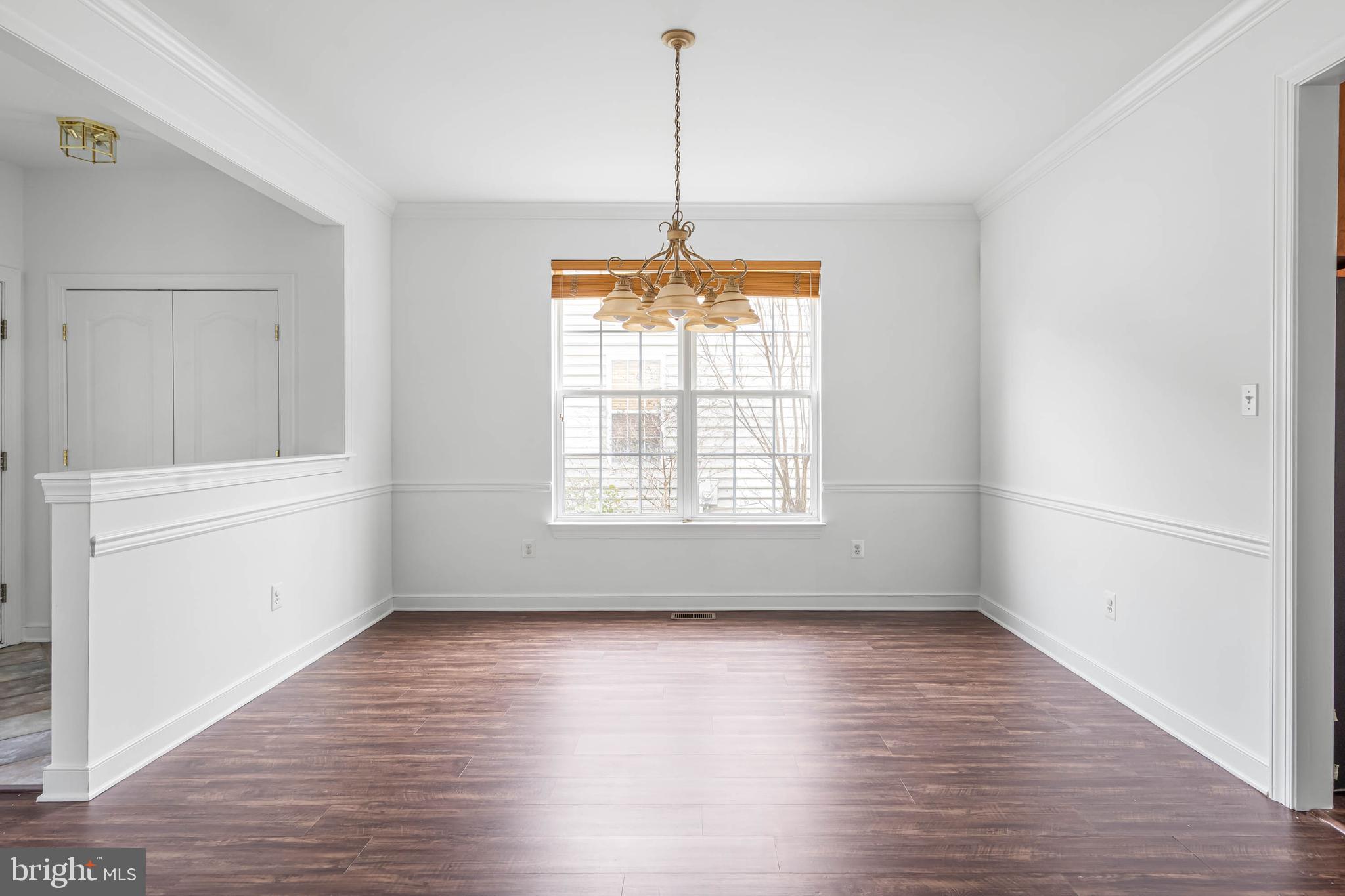 35560 Dry Brook Drive Rehoboth Beach, DE 19971 - Photo 13 of 63 a view of a room with wooden floor and windows