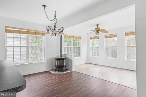 a living room with furniture and floor to ceiling window