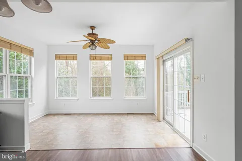 a view of a kitchen with a sink and microwave