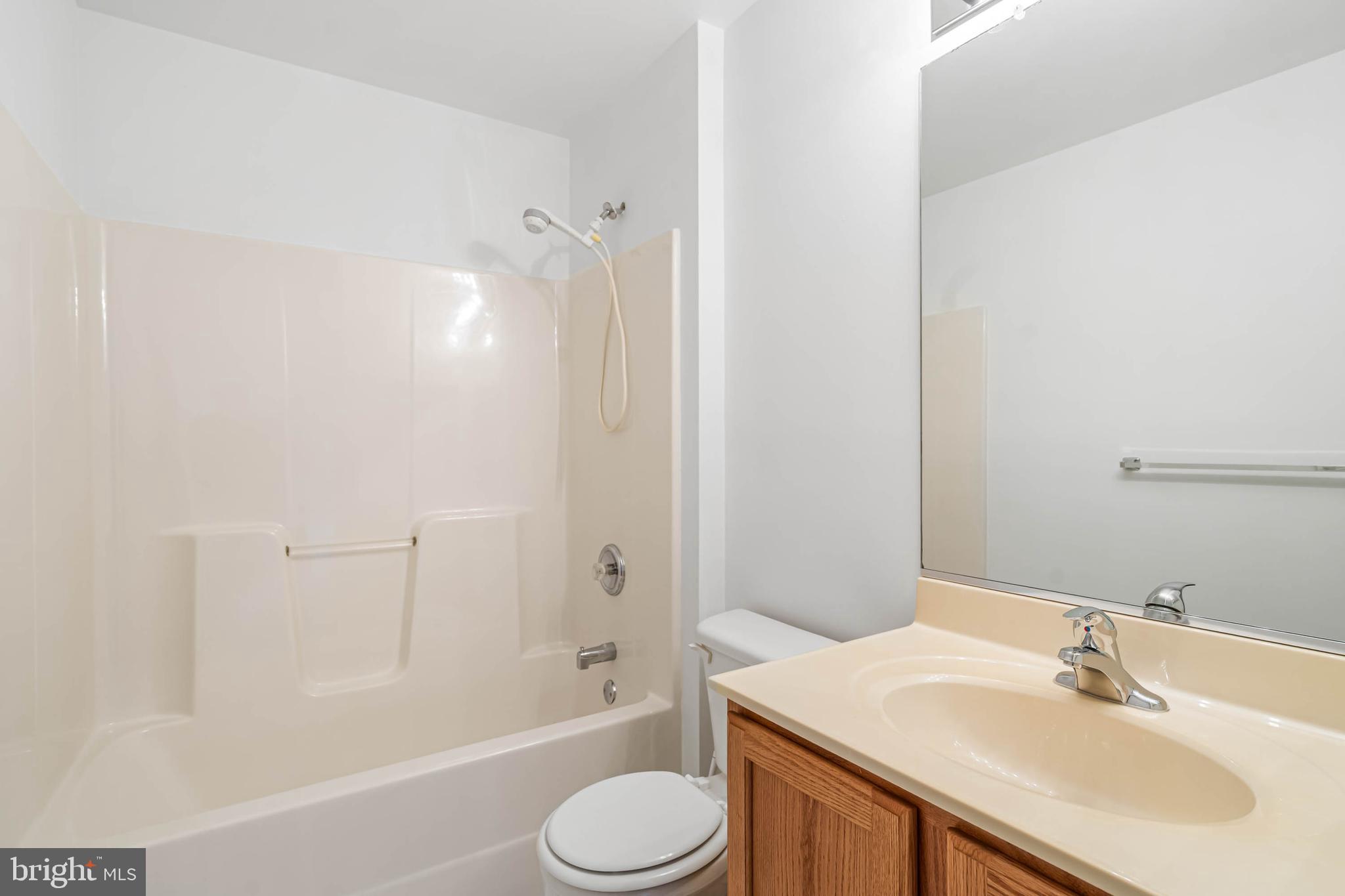 35560 Dry Brook Drive Rehoboth Beach, DE 19971 - Photo 50 of 63 a bathroom with a sink toilet and shower