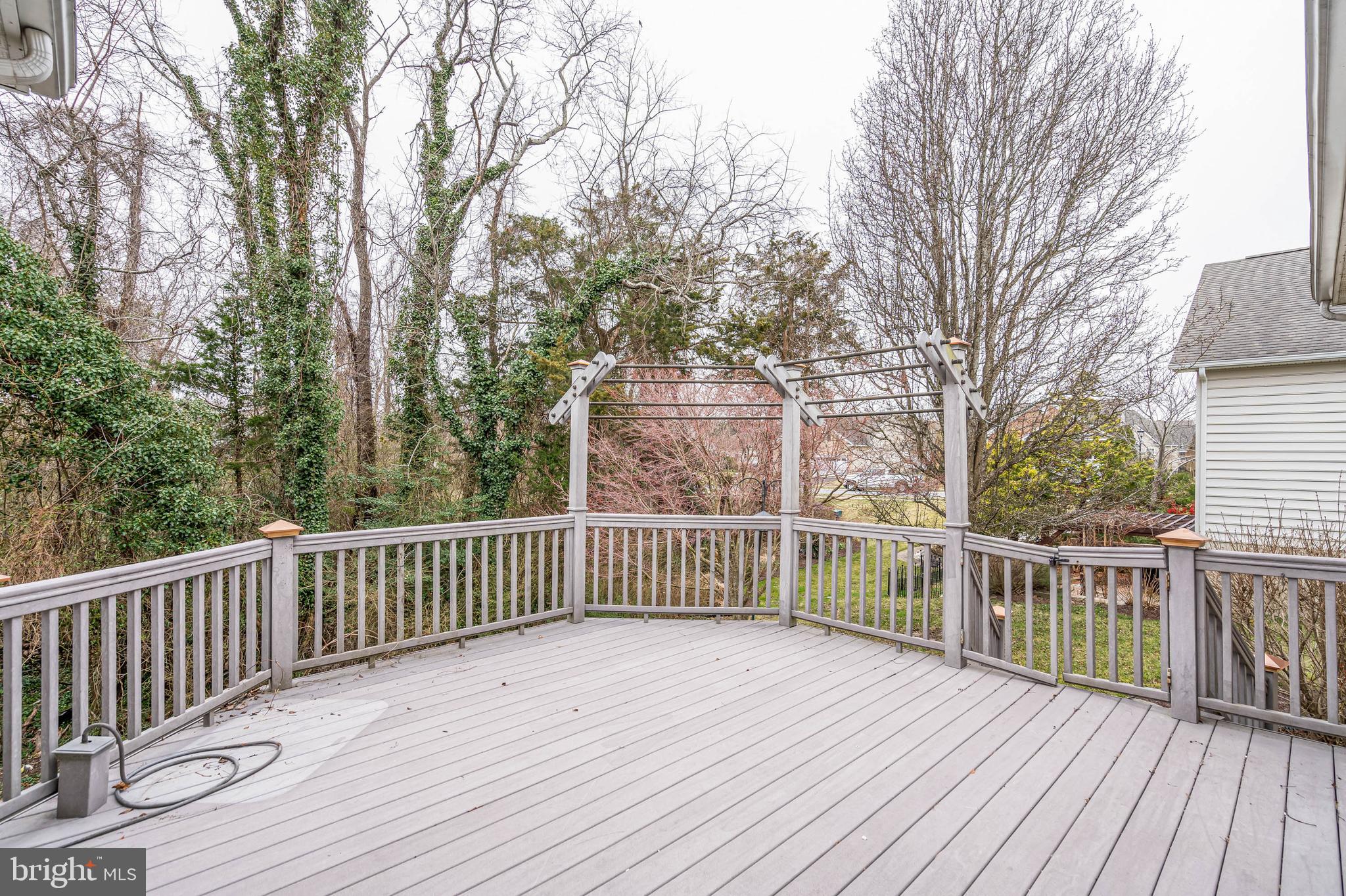 35560 Dry Brook Drive Rehoboth Beach, DE 19971 - Photo 54 of 63 a view of deck with wooden floor and fence