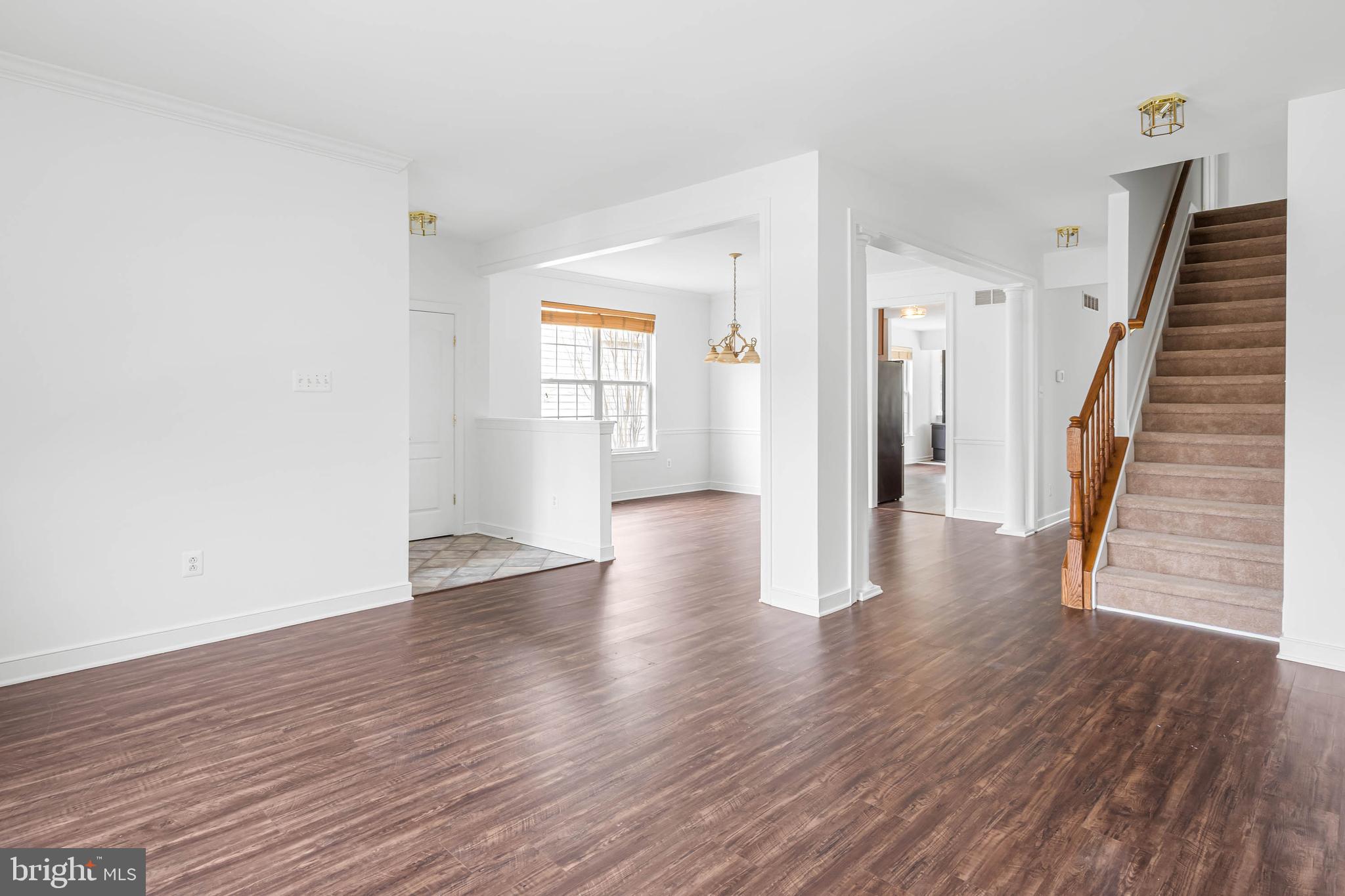 35560 Dry Brook Drive Rehoboth Beach, DE 19971 - Photo 10 of 63 wooden floor in an empty room with a window