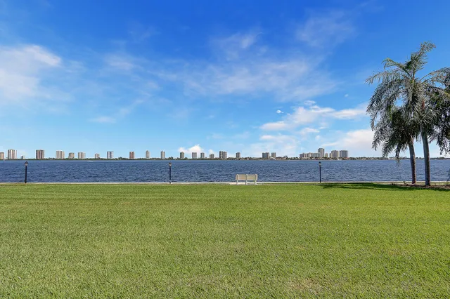 a view of a swimming pool and an outdoor seating