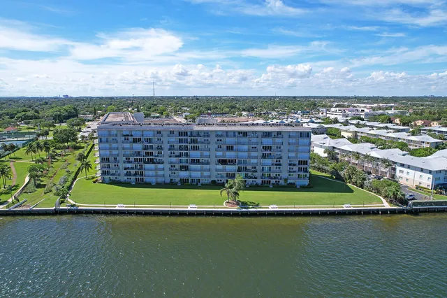 a view of a lake with houses in the back