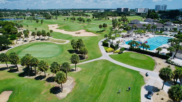 an aerial view of a house with yard swimming pool and outdoor seating