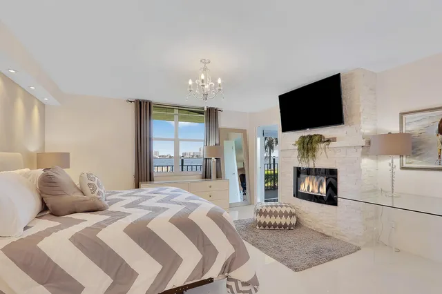 a bedroom with a bed and a television