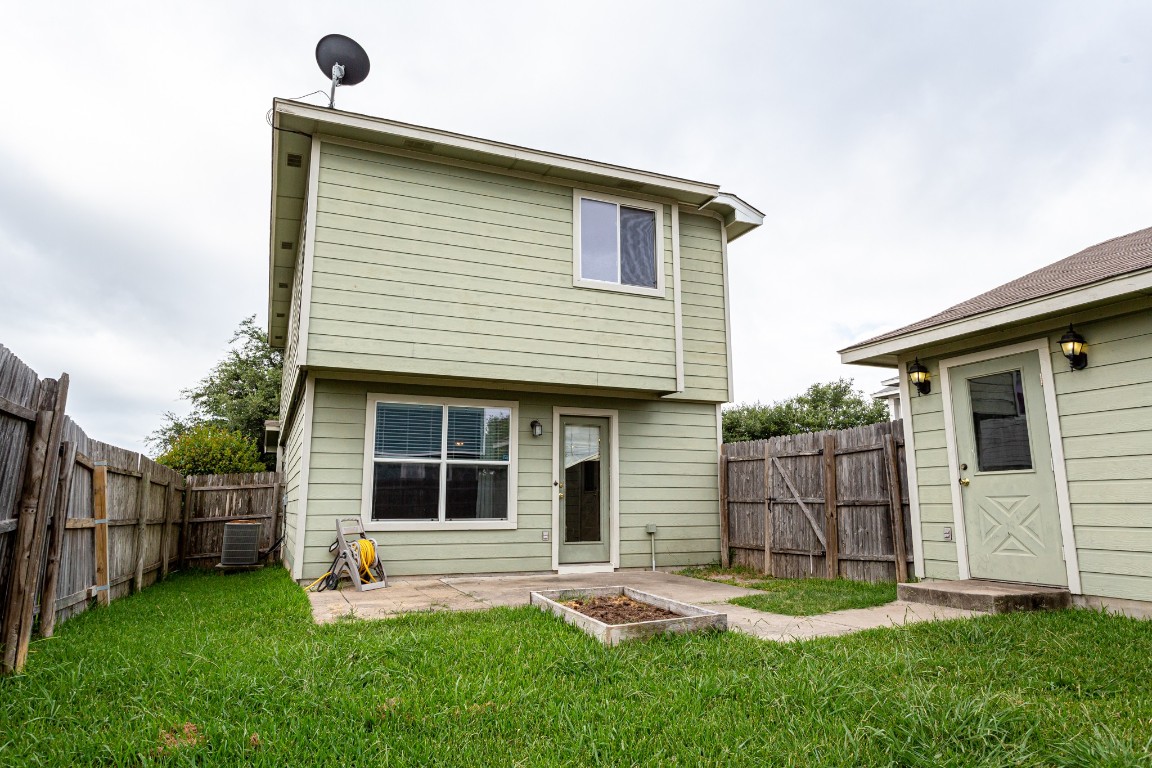 2724 Amberglow Court Round Rock, TX 78665 - Photo 17 of 18 a front view of a house with a yard and garage