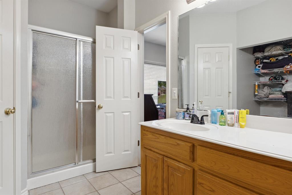 118 Cagle Quinlan, TX 75474 - Photo 14 of 23 a bathroom with a sink and a mirror