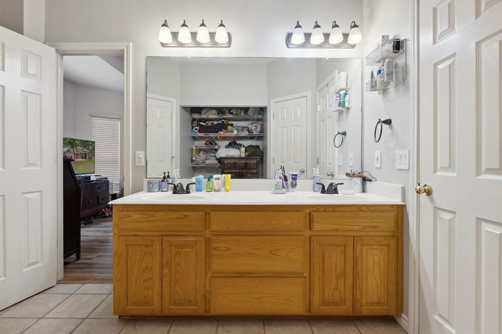 118 Cagle Quinlan, TX 75474 - Photo 15 of 23 a bathroom with a sink double vanity and a mirror