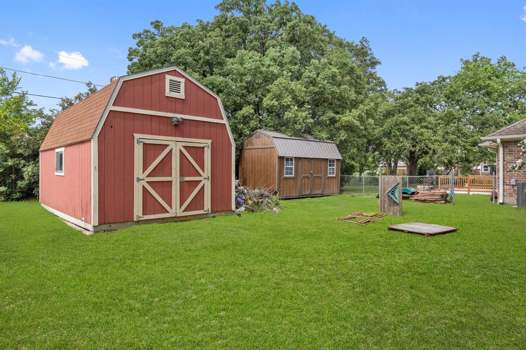 118 Cagle Quinlan, TX 75474 - Photo 19 of 23 a front view of a house with garden