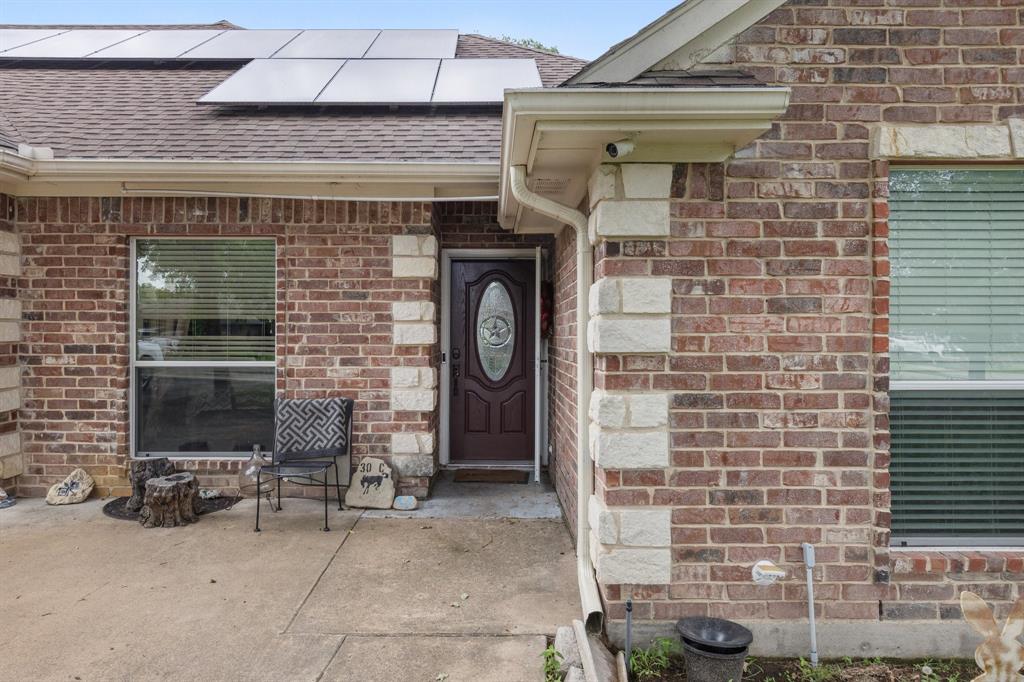 118 Cagle Quinlan, TX 75474 - Photo 2 of 23 a front view of a house with outdoor seating