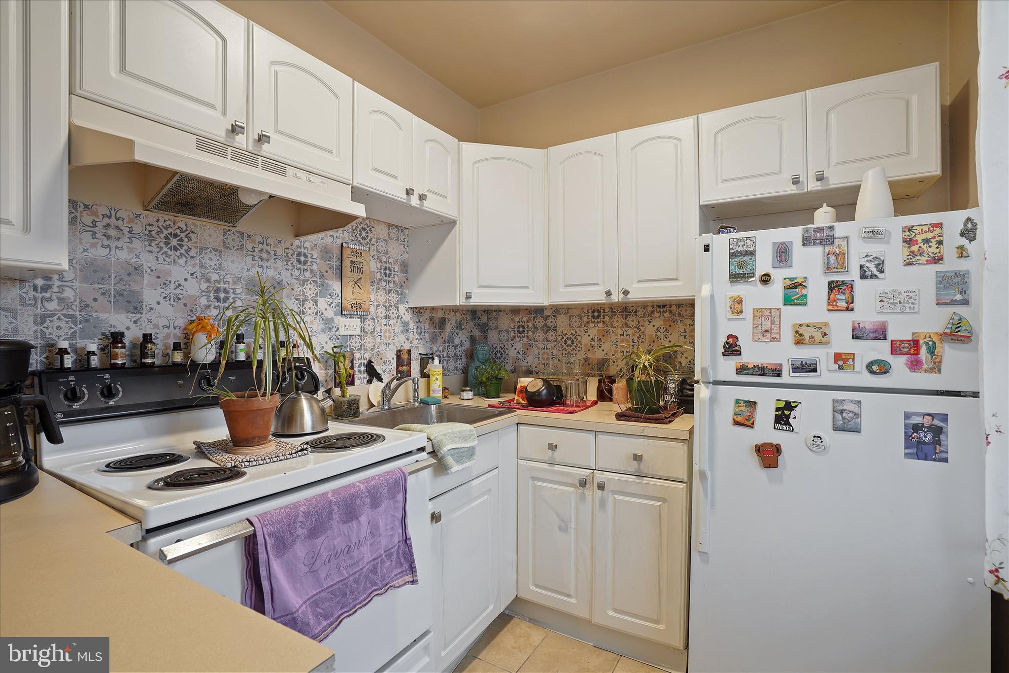 300 Friedensburg Road Reading, PA 19606 - Photo 13 of 26 a kitchen with stainless steel appliances granite countertop a stove a sink and a refrigerator