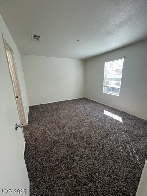 4561 Woolcomber Street Las Vegas, NV 89115 - Photo 12 of 19 Spare room with carpet floors and baseboards