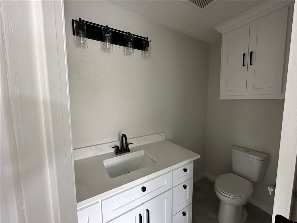 2507 Oak Circle Bryan, TX 77802 - Photo 16 of 34 a bathroom with a toilet and a sink