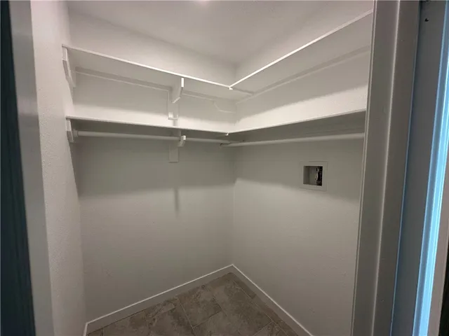 a bathroom with a sink and mirror with toilet