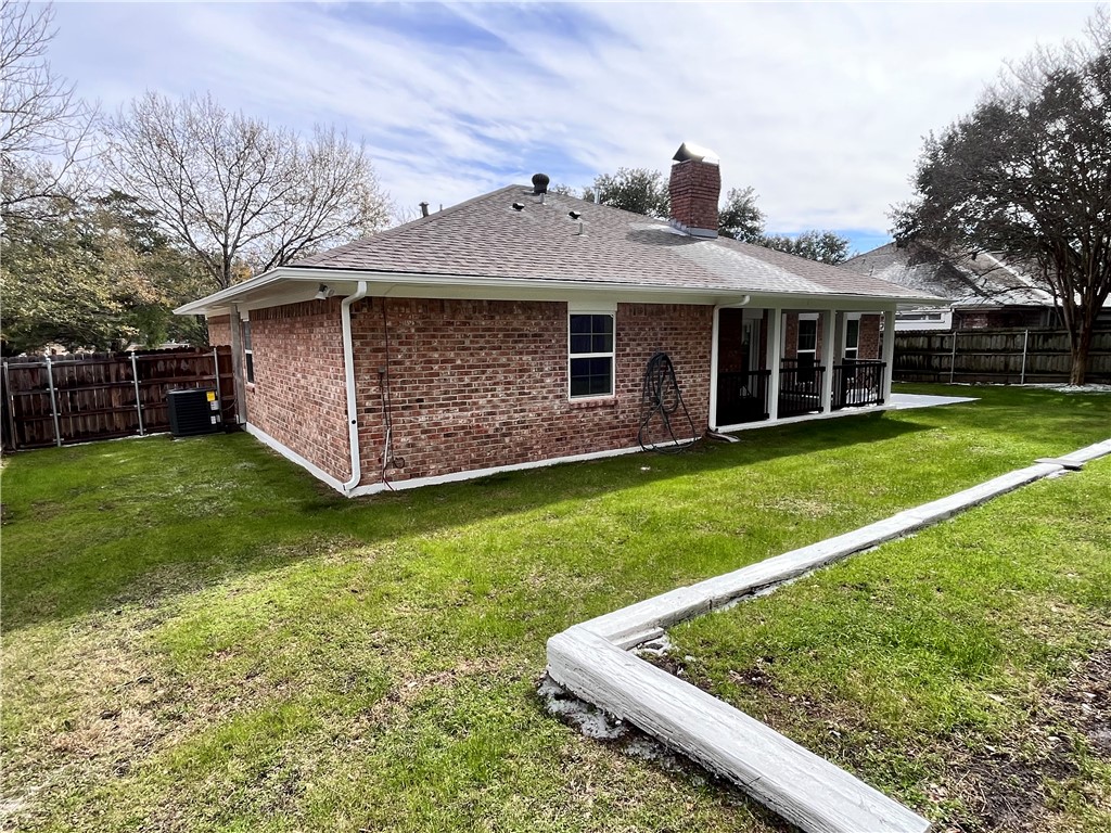 2507 Oak Circle Bryan, TX 77802 - Photo 31 of 34 a front view of a house with garden