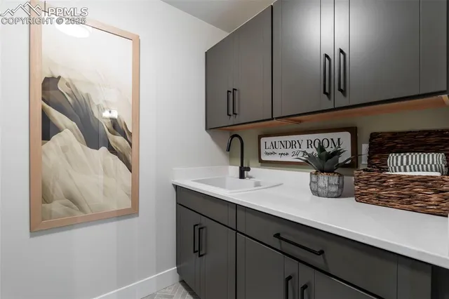 a kitchen with a sink and cabinets