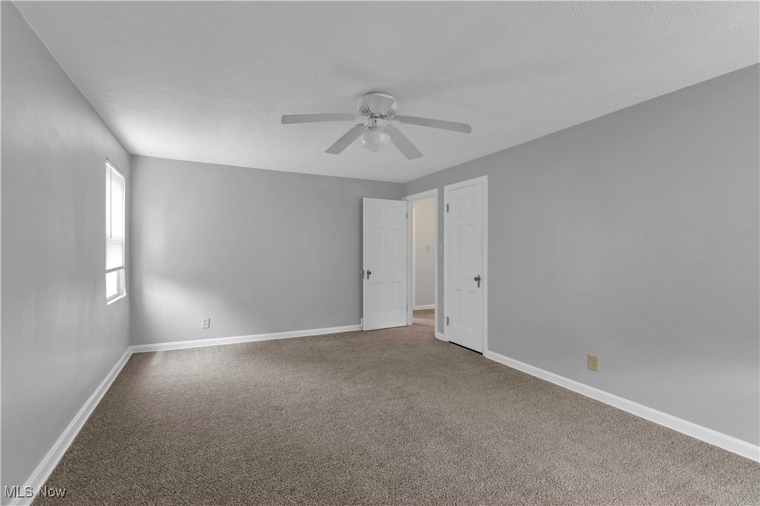 3385 Rosedale Road Cleveland, OH 44112 - Photo 23 of 40 Carpeted empty room with a ceiling fan and baseboards