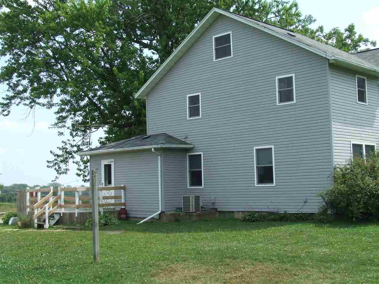 8765 North Lake Road Lena, IL 61048 - Photo 11 of 12 a house that has a backyard