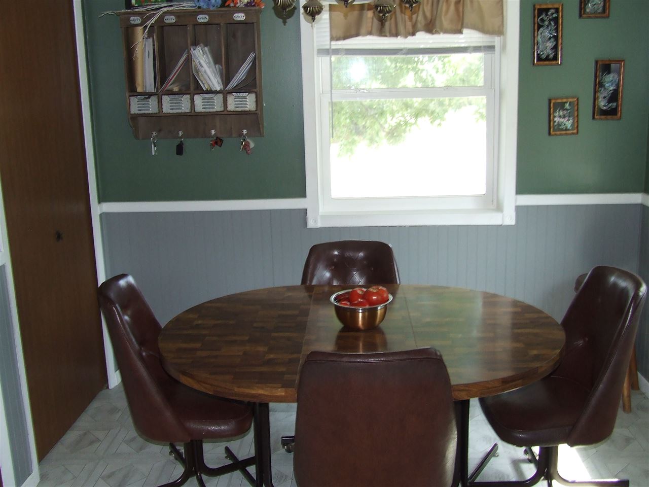 8765 North Lake Road Lena, IL 61048 - Photo 6 of 12 a view of a dining room with furniture and window