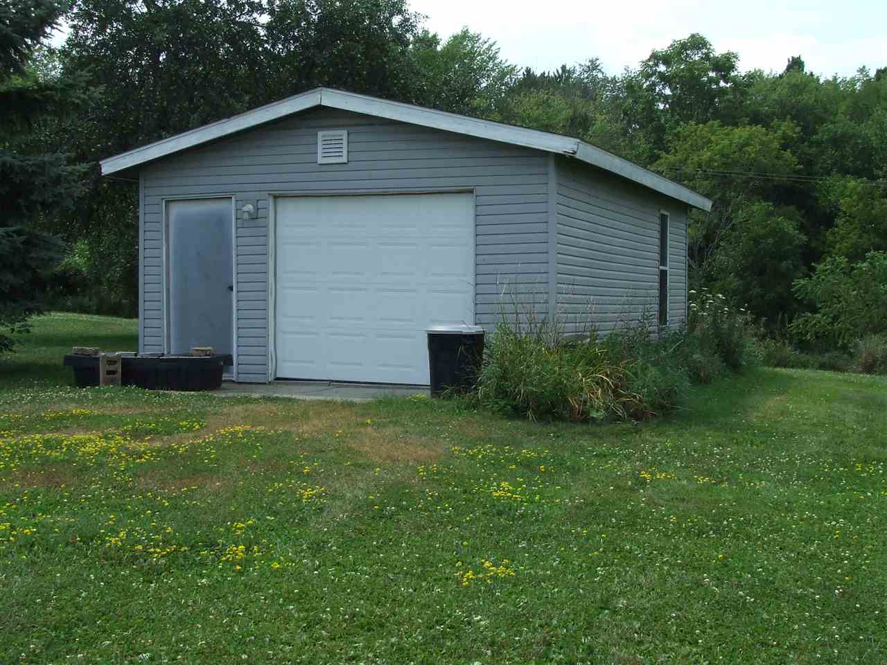 8765 North Lake Road Lena, IL 61048 - Photo 9 of 12 a view of a backyard of the house